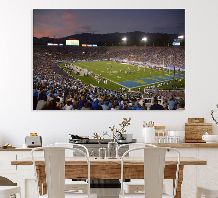 Admire the stunning wall art canvas depicting a UCLA Bruins game with a sunset over the Pasadena Rose Bowl Stadium.