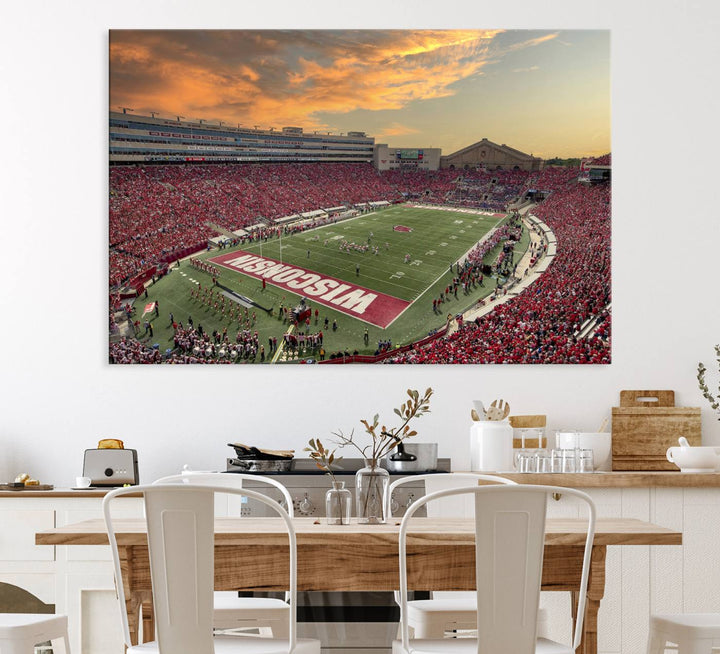 The wall features a Wisconsin Badgers wall art canvas print, capturing the vibrant atmosphere of a full Camp Randall Stadium at sunset.