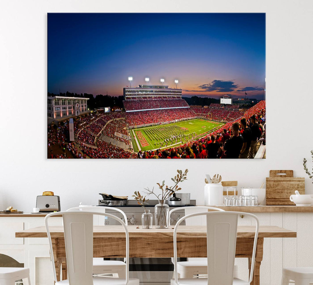 The Wolfpack Football Team Print captures a band and crowd at dusk in a premium canvas art style at Raleigh Carter-Finley Stadium.