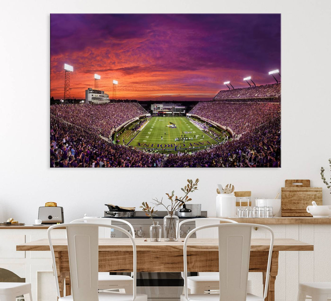 A sunset over Dowdy-Ficklen Stadium, Greenville, captured on museum quality canvas with vibrant purple and orange skies.