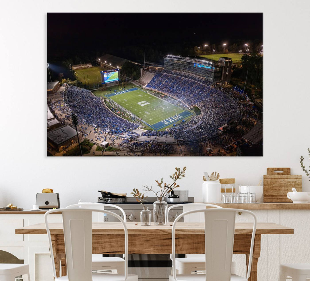 Night aerial view of packed Duke Blue Devils Wallace Wade Stadium, surrounded by trees and illuminated by lights; perfect for high-resolution prints.