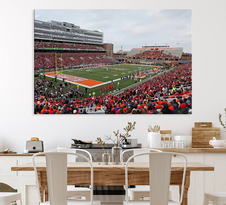 A University of Illinois Fighting Illini wall art canvas hangs on the wall, depicting a packed stadium.