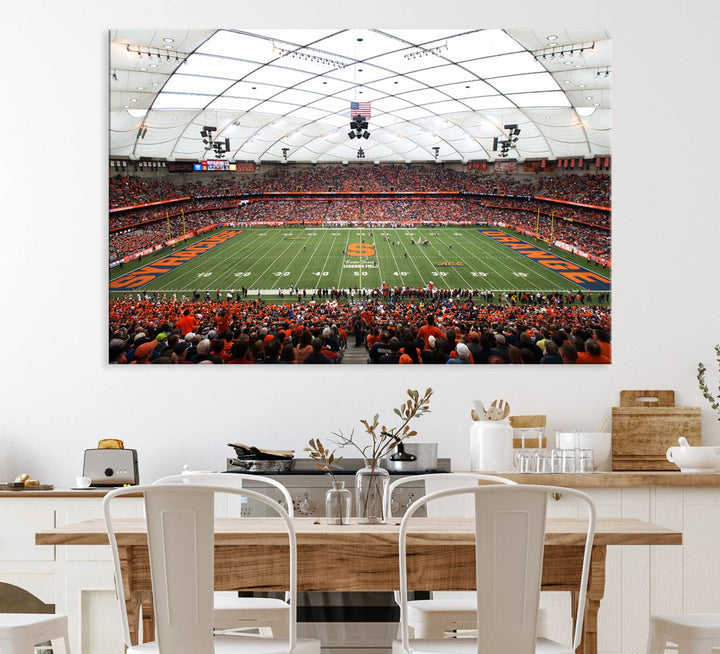 Fans fill the Syracuse JMA Wireless Dome, highlighted in orange and blue under a vaulted roof on this premium canvas print of the scene.