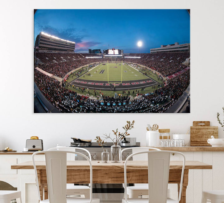 The wall art in the living room features a Texas Tech Red Raiders Football Team Print, showcasing Jones AT&T Stadium at dusk.