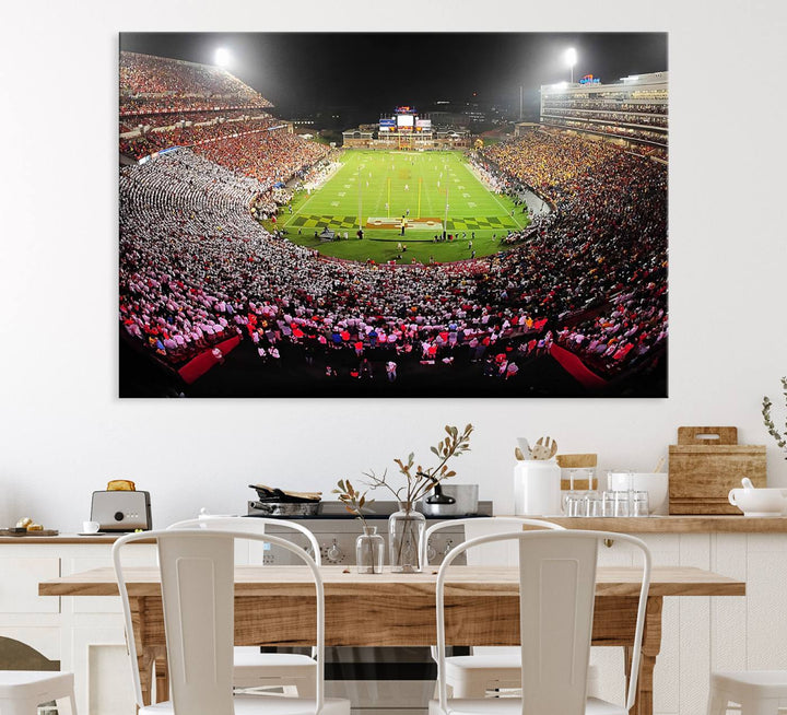 The Maryland Terrapins Football Wall Art Canvas showcases a packed SECU Stadium at night with a bright field and cheering fans.