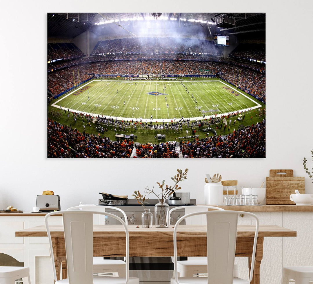 The modern living room features an Alamodome wall art canvas print, depicting a stadium filled with spectators for a UTSA Roadrunners game.