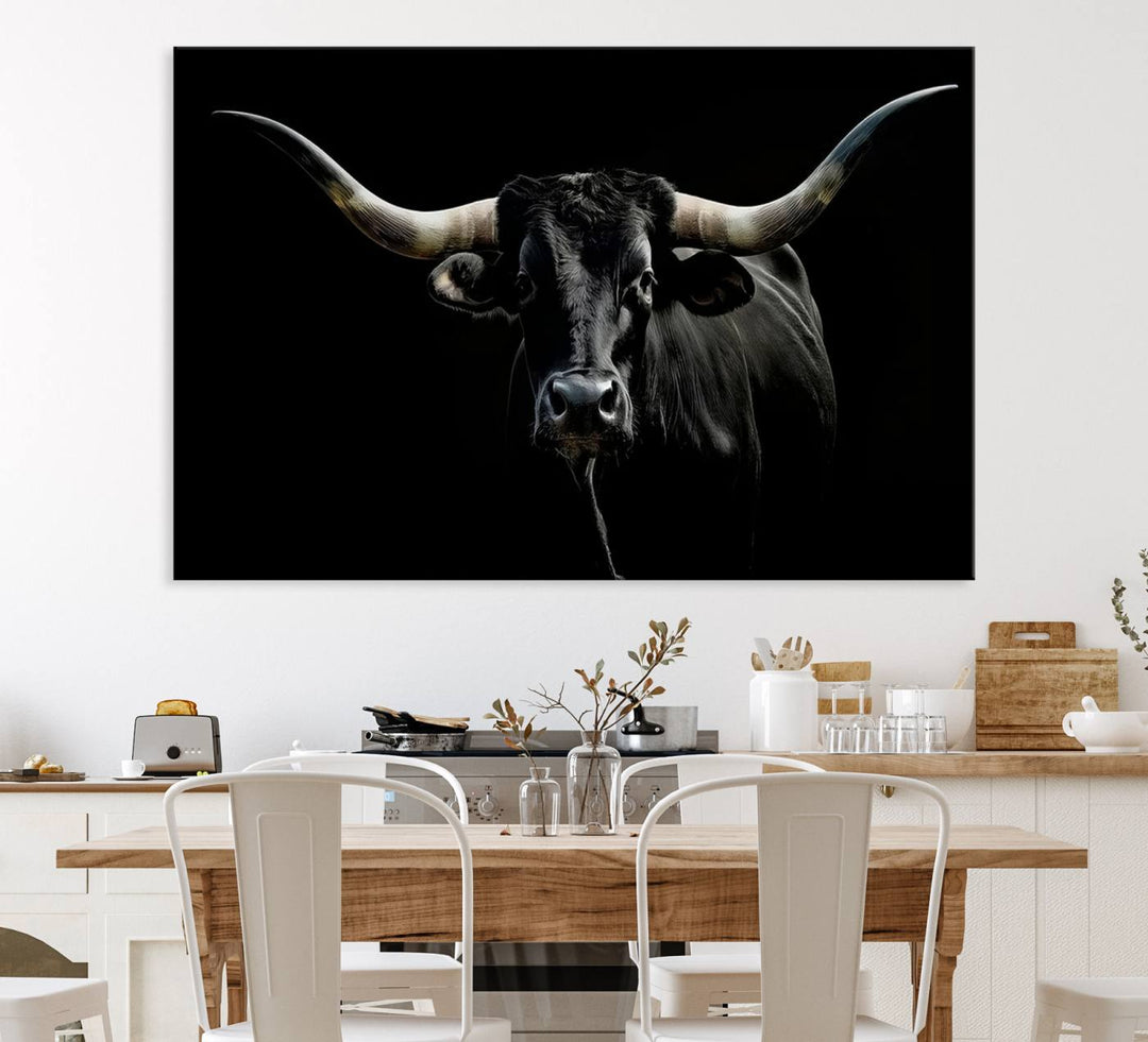 The Texas Black Longhorn Bull Canvas Print, featuring large curved horns set against a dark background, is ideal for Western decor.