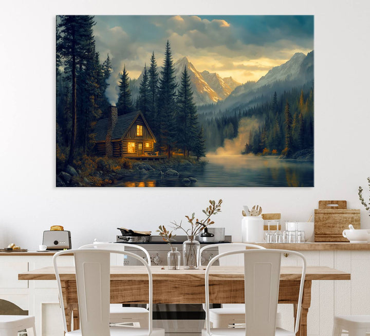 Serene sunset lake wall art: a cozy mountain cabin with lights, framed by pine trees and set against a moody sky. Ideal for adding rustic lodge charm to your space.