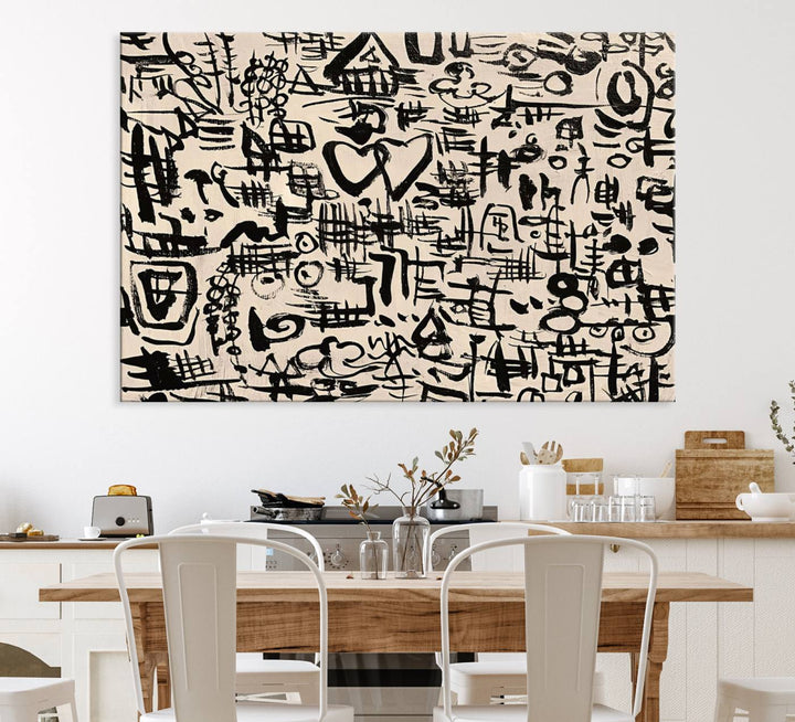 The Abstract Love and Chaos canvas is a museum-quality print featuring black symbols on a beige background, adorned with a heart and scribble design. It is framed to enhance its artistic appeal.