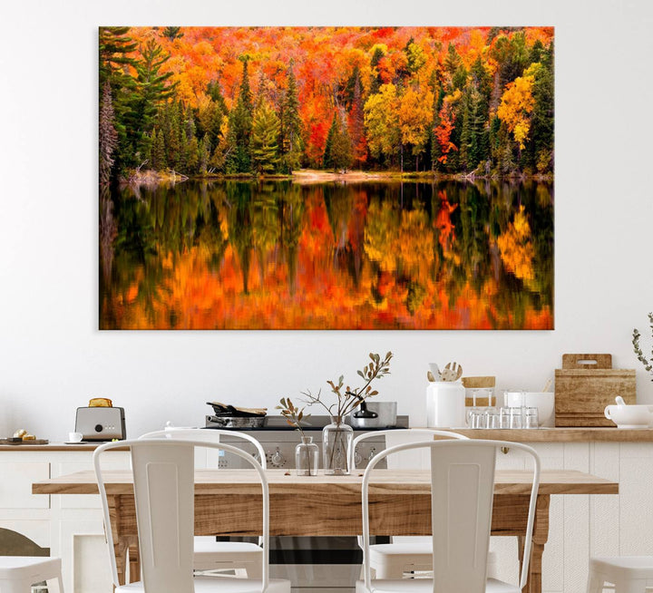 Autumn Forest Reflection Wall Art: a vibrant triptych canvas featuring fall foliage with red, orange, and yellow leaves over a calm lake.