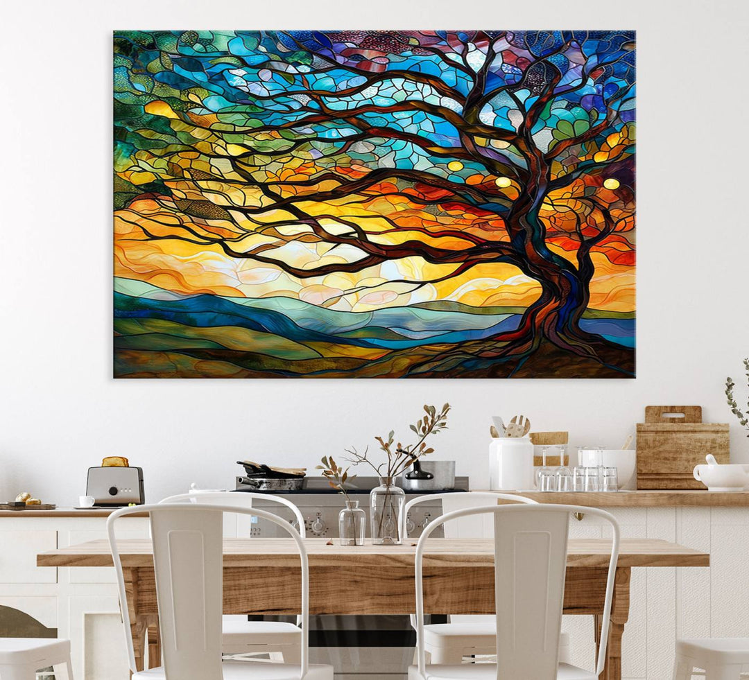 A vivid Tree of Life in stained glass style is depicted with twisted branches, a colorful sky, and hills on a ready-to-hang canvas.