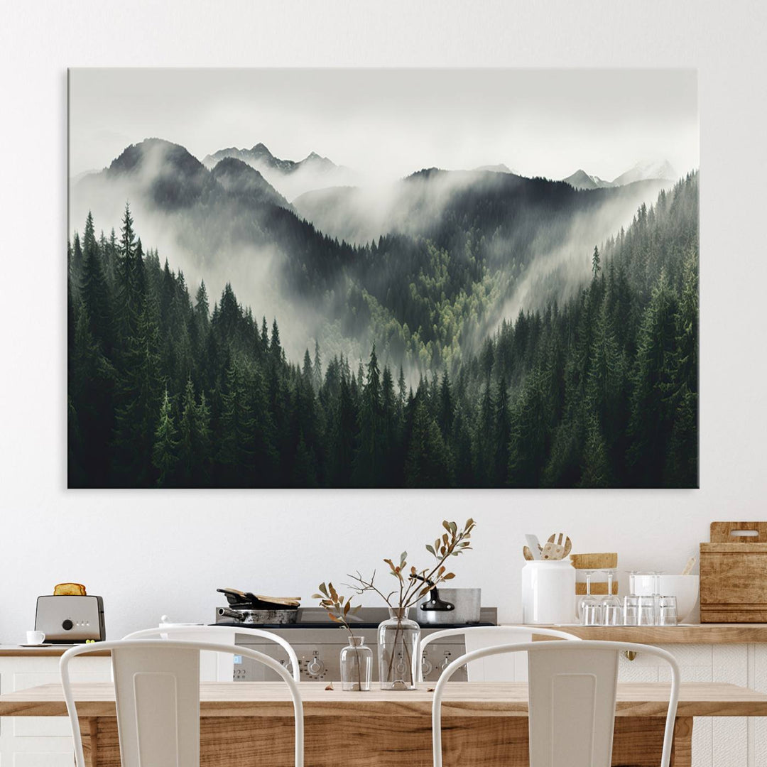 The Misty Forest Canvas Print Wall Art captures a serene misty forest scene with fog and mountains.