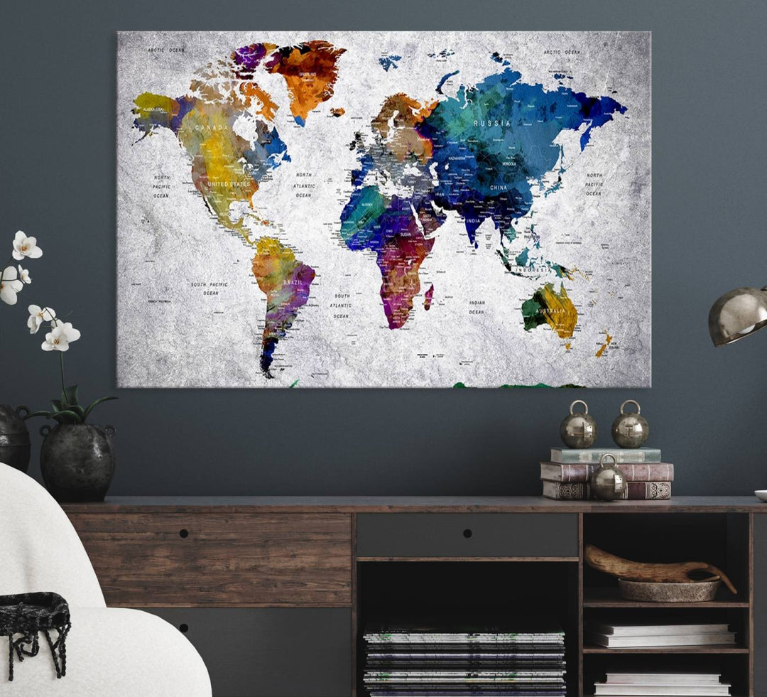 The World Map Art Canvas Print, featuring country names on a grunge-stained gray background, is perfect for stylish home decor.