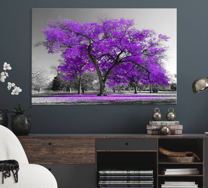 The Big Purple Tree Wall Art Canvas Print showcases a vibrant purple tree set against a black-and-white landscape.