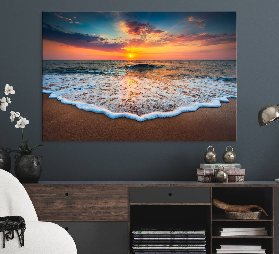 A Sunset with Calm Waves on the Beach Wall Art Canvas Print adorns the dining room.