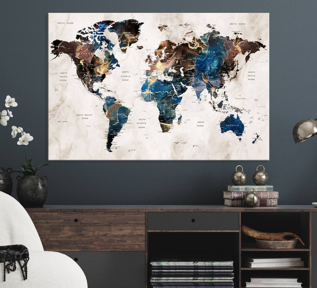 Abstract earth-toned 3-panel world map wall art featuring blues and browns, ready to hang; it showcases continents on modern canvas.