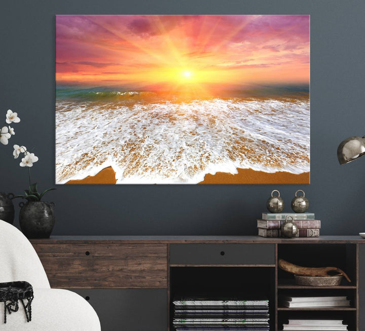 Golden Beach Sunrise 3-panel canvas art of ocean waves, hung on a wooden wall.