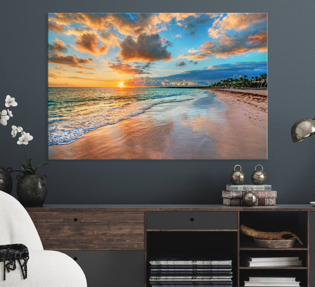 A wall displays Sunset Ocean Waves on Tropical Beach 3-panel canvas art.