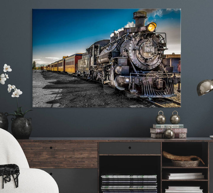 The Train Wall Art Canvas Print features a vintage steam train with a bright headlight.