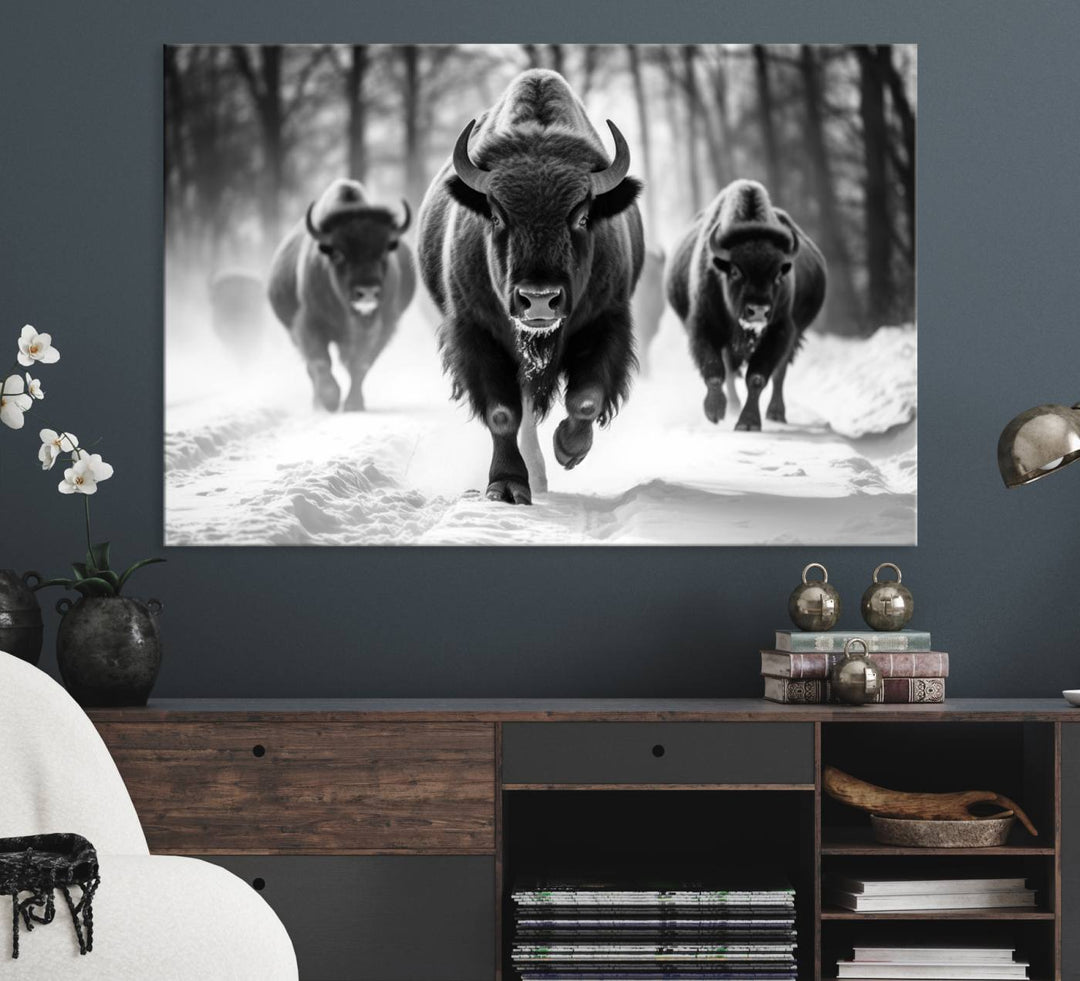 The Buffalo Wall Art Canvas Print of bison running through snow adorns the wall.