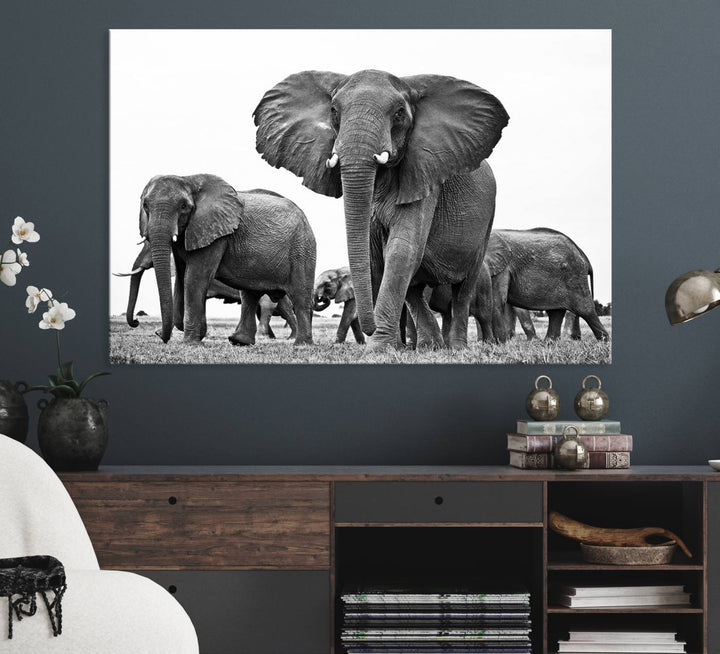 A modern dining area features a Black White Elephant Family Wall Art Canvas Print.