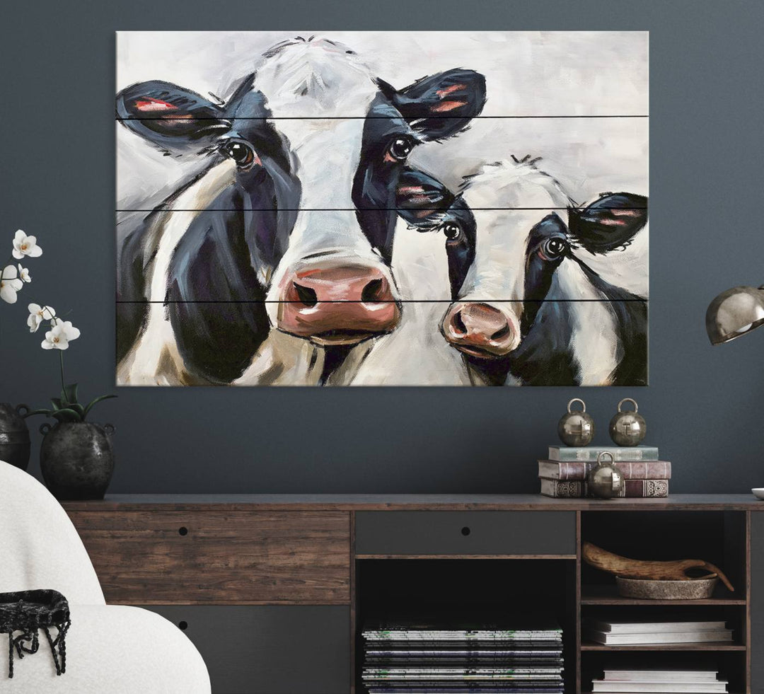 The Vintage Baby and Mom Cattle Canvas, featuring cows with black and white patches, is a prominent piece of wall art.