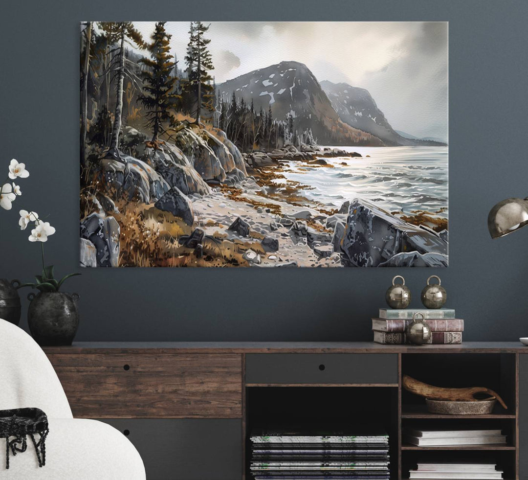 Framed wall art depicting Acadia National Parks rocky coast, trees, mountains, and sunlight over the sea; ready to hang.