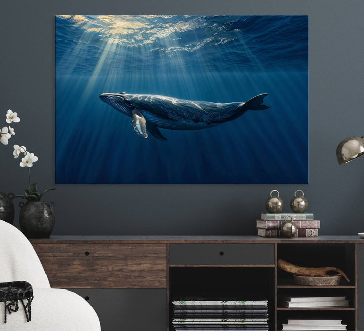 The Whale under Ocean wall art canvas print graces the white wall.