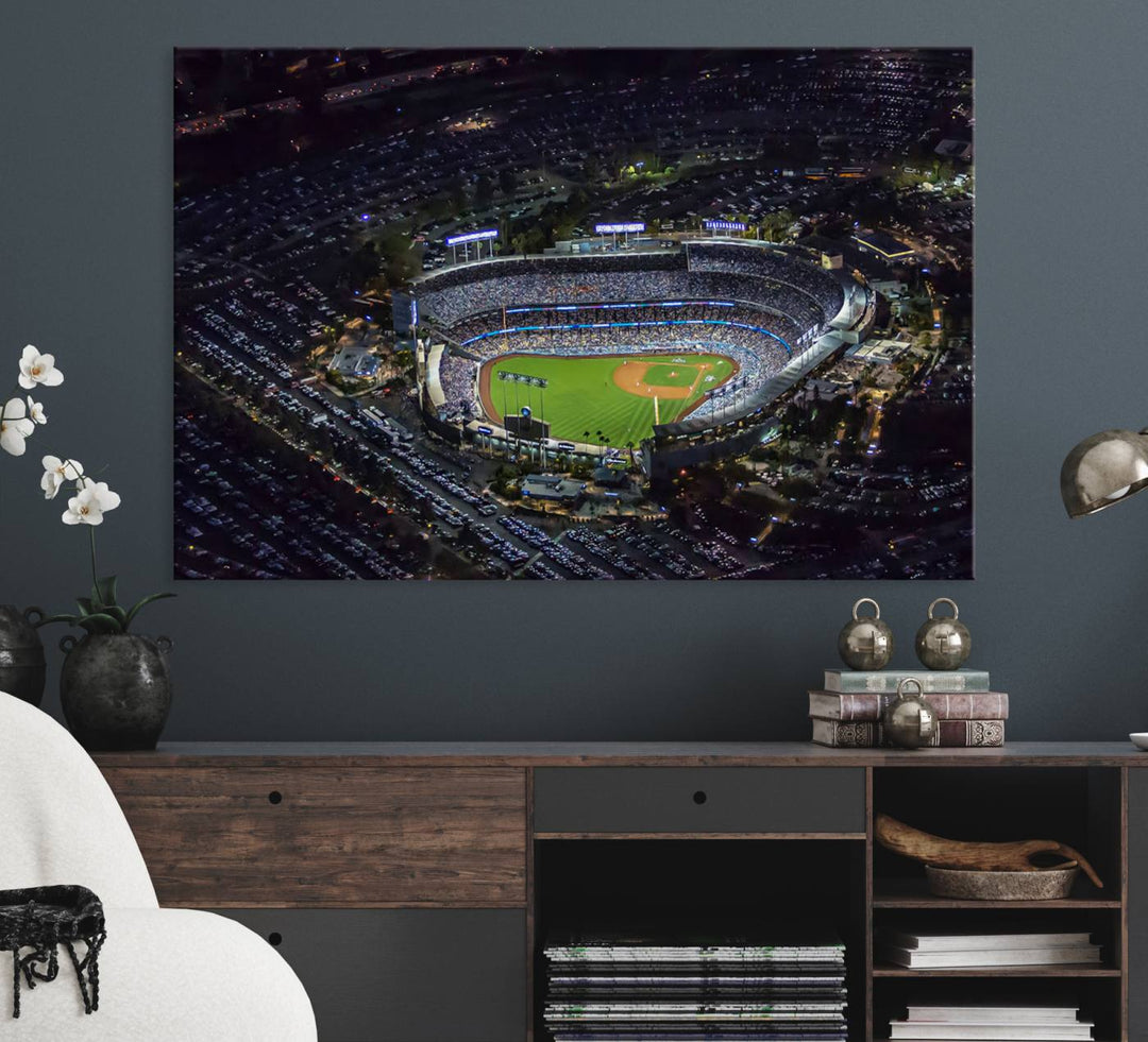 A large Los Angeles Dodgers print of Dodger Stadium at night is displayed near a window.