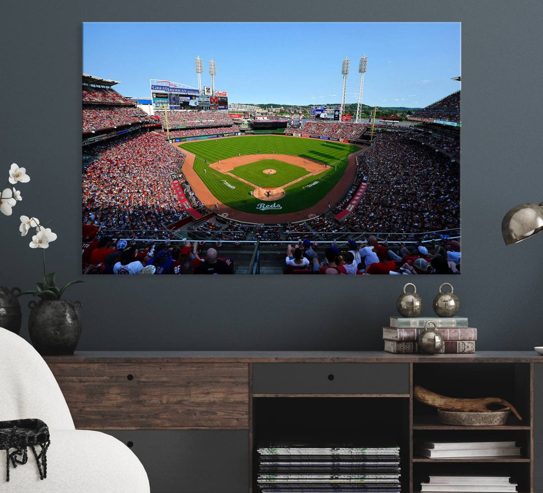 The Cincinnati Reds Baseball Team print of Great American Ball Park Stadium adorns the wall.