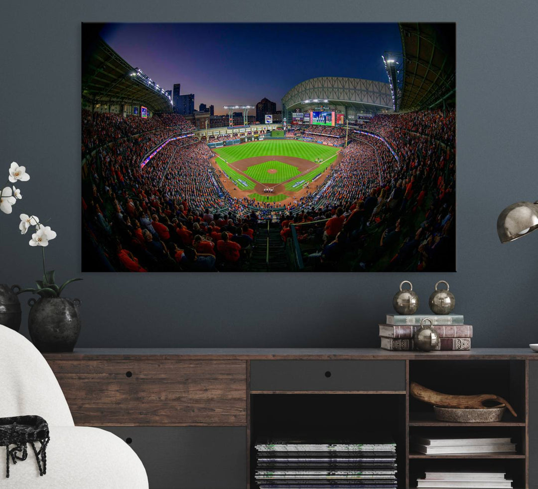 A canvas print of Houston Minute Maid Park at dusk is mounted on the wall.