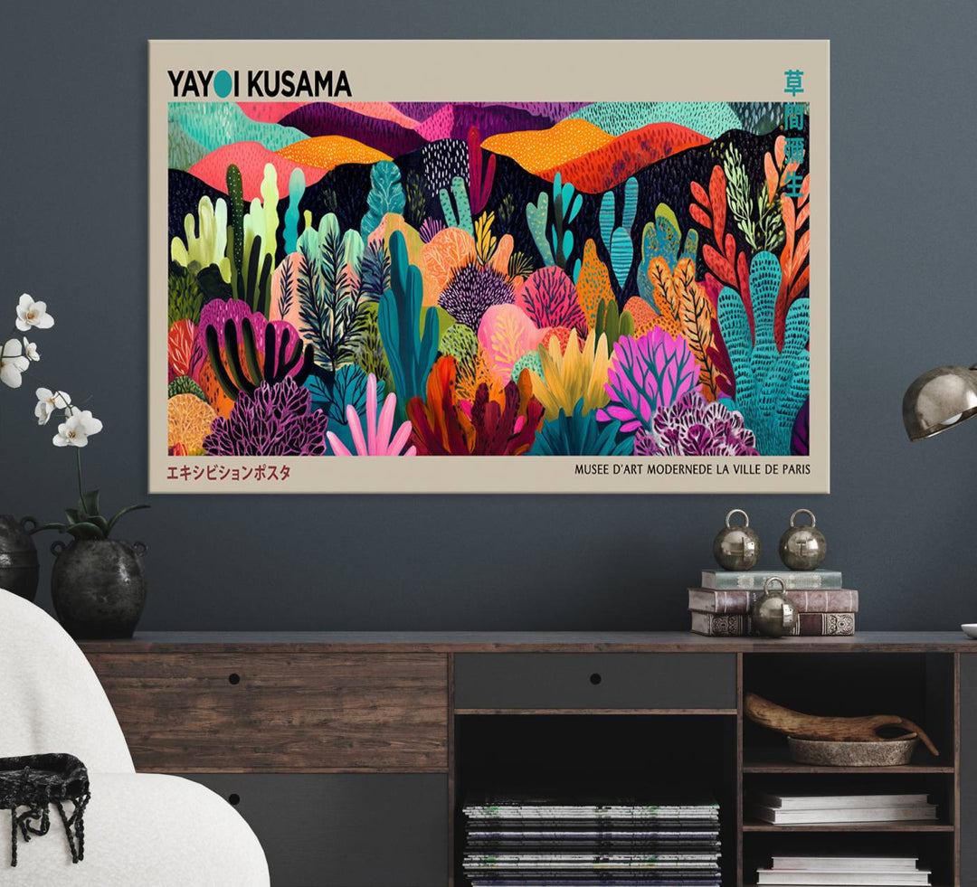 The framed Yayoi Kusama wall art adds vibrancy above the blue couch.