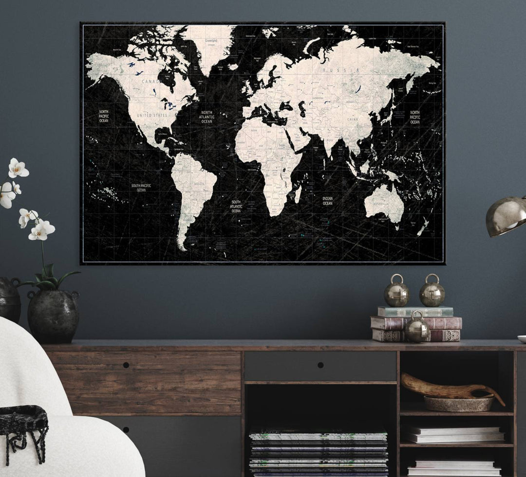 The Black & White World Map Canvas Wall Art, a giclee print, elegantly decorates the wall.