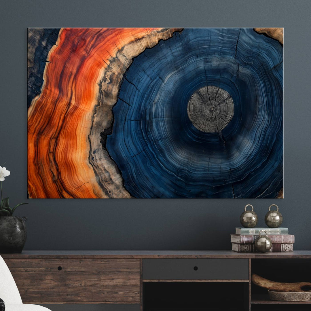 Abstract Tree Ring Wall Art Print on canvas featuring vibrant blue, orange, and brown rings with a natural rustic wood texture. Free shipping available!.