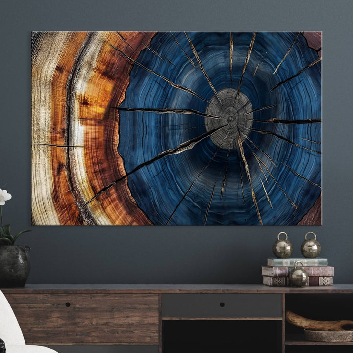 The Abstract Tree Rings Canvas Print features blue, brown, and orange rings that highlight wood grain and natures beauty.