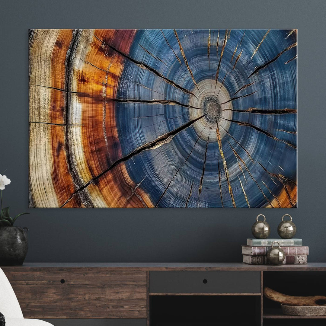 Close-up of blue, brown, and orange wood grain rings on the Abstract Tree Rings Canvas Wall Art Print.