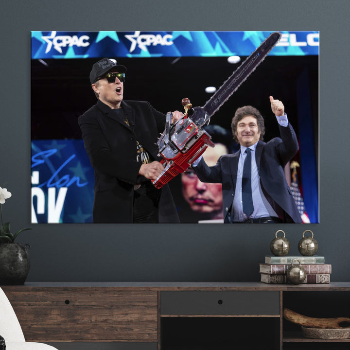 The wall art in the living room is an Elon Musk Chainsaw Art Print, depicting two men with chainsaws on stage in front of a vibrant crowd.