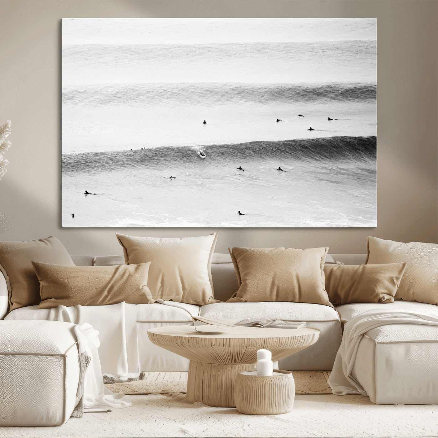 A monochrome photograph of swimmers gliding through gentle ocean waves, evoking a sense of calm and movement.