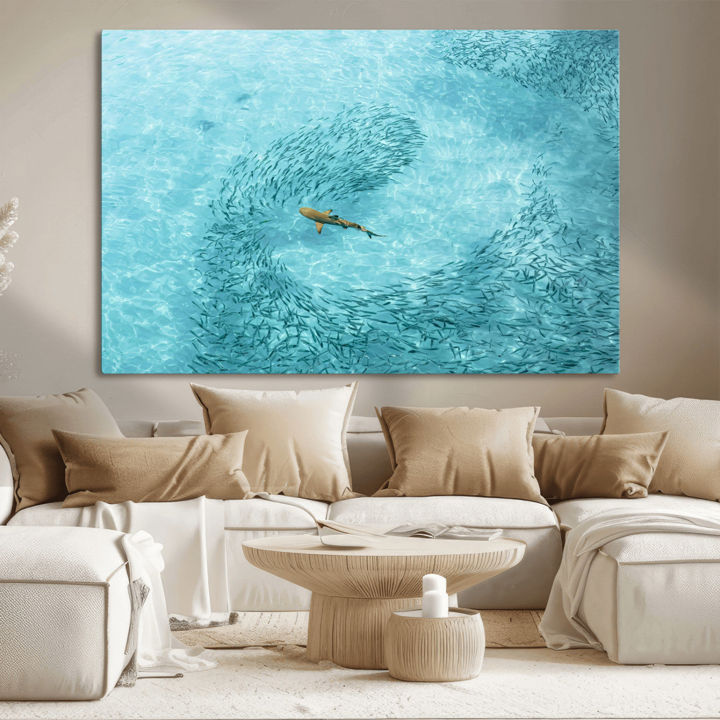 Aerial view of a shark swimming through a swirl of fish in clear turquoise waters, perfect for calm coastal or beach house decor.