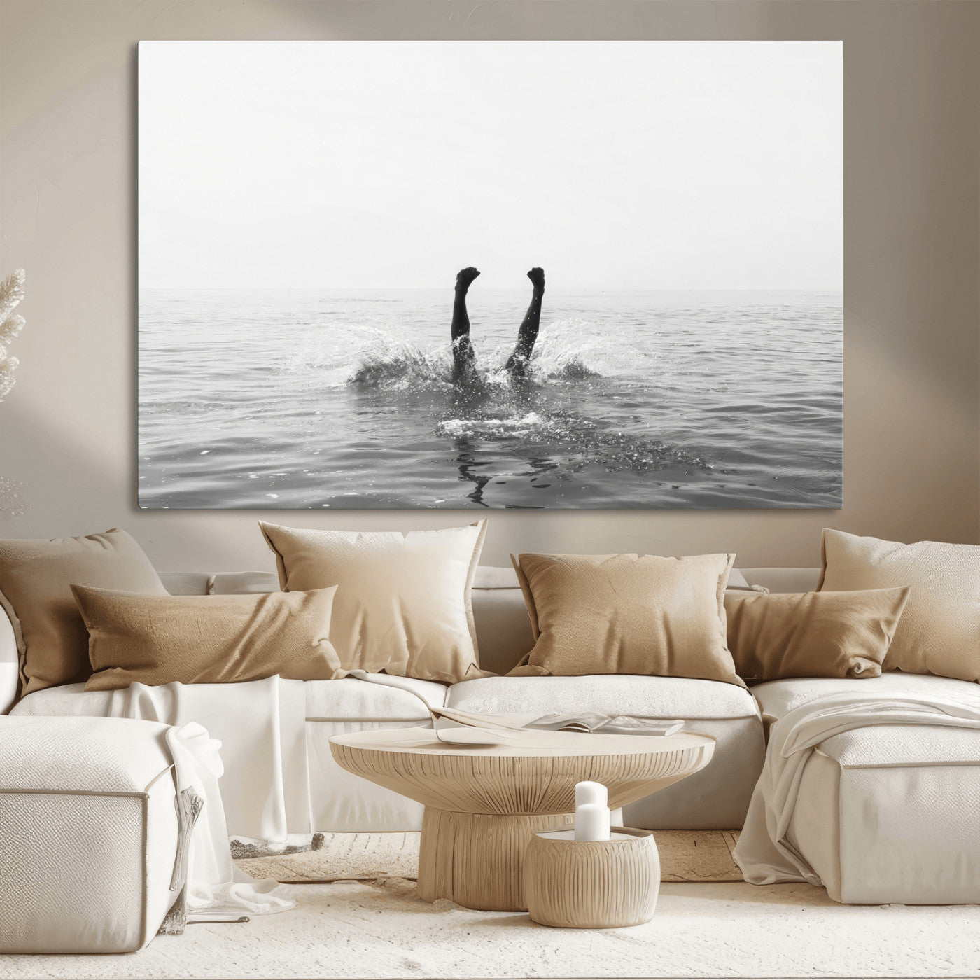 A black and white minimalist water scene capturing a playful splash as a swimmer dives upside down, creating a carefree and artistic aquatic aesthetic.