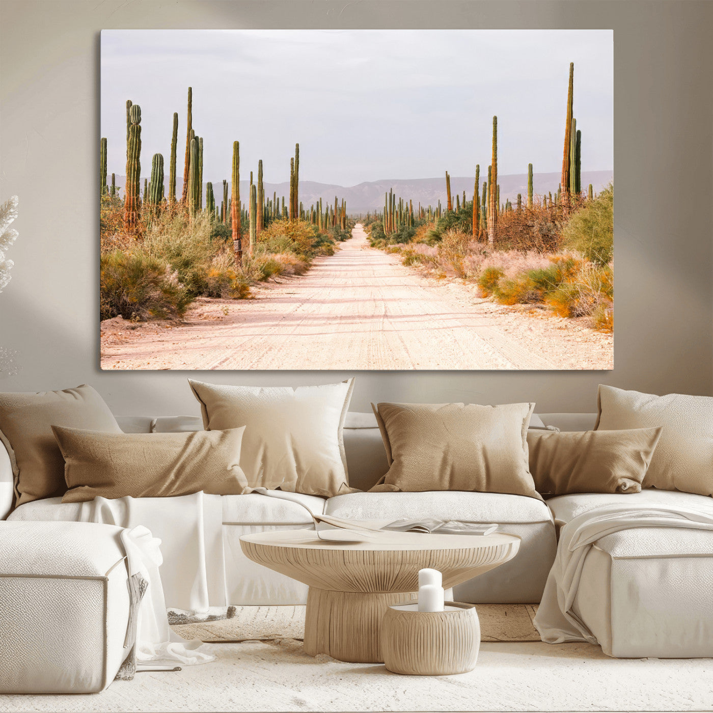 A desert road lined with saguaro cacti under a golden sky, creating a warm southwestern feel, perfect for boho or rustic decor.