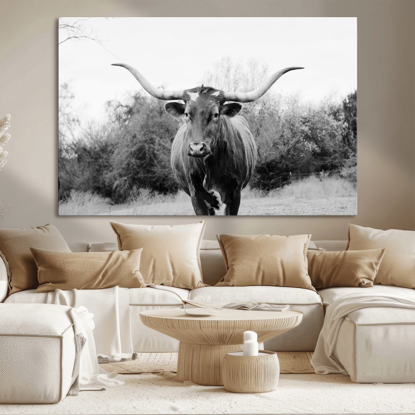 Black and white photo of a Longhorn cow facing camera, ideal for rustic, farmhouse, or western-themed home wall decor.