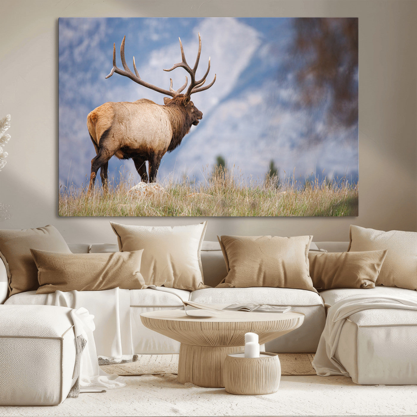 Elk with antlers standing on grass with mountain background, ideal for rustic, cabin, or lodge-inspired wall decor.