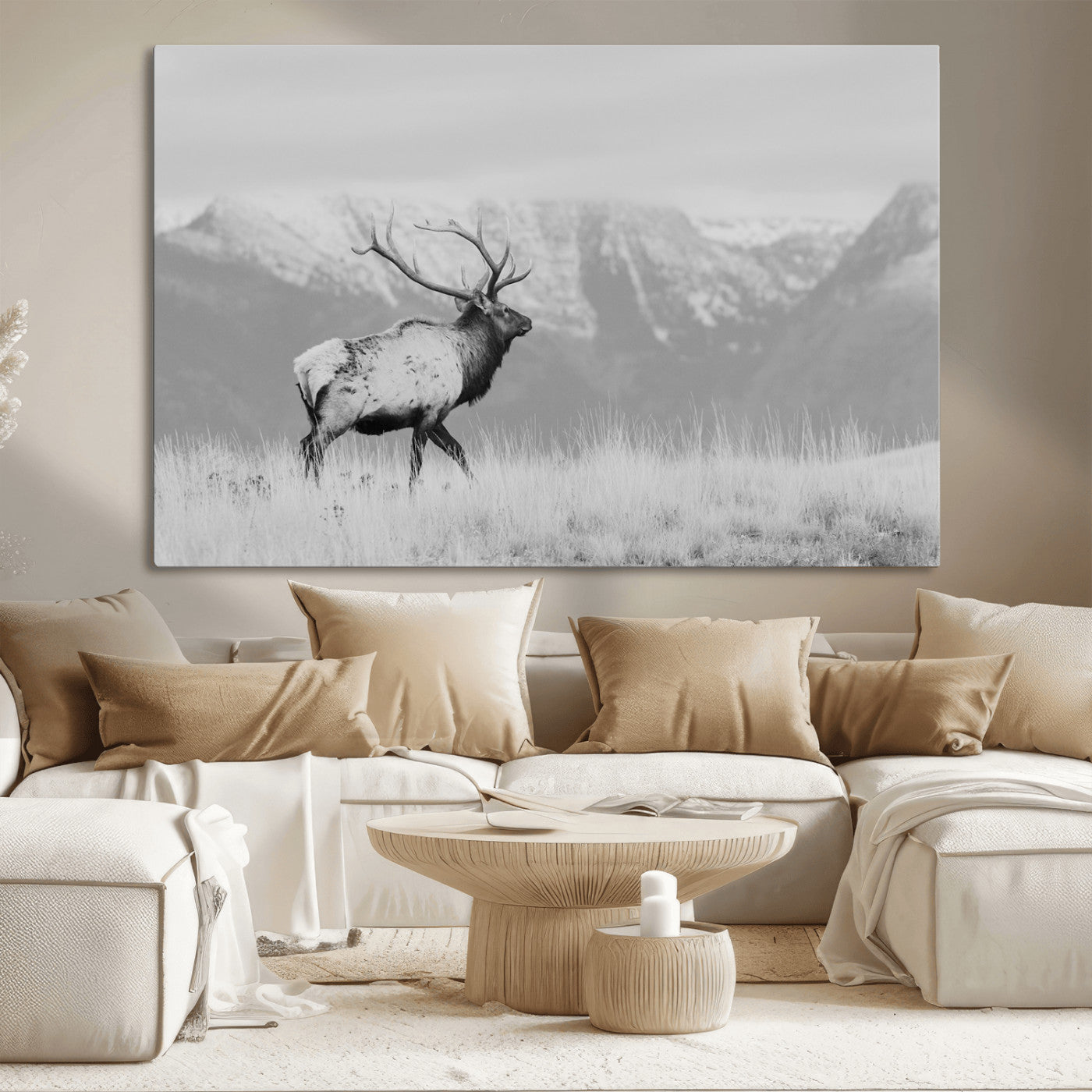 Black and white elk standing in front of snowy mountain range, perfect for rustic lodge or nature-inspired wall decor.