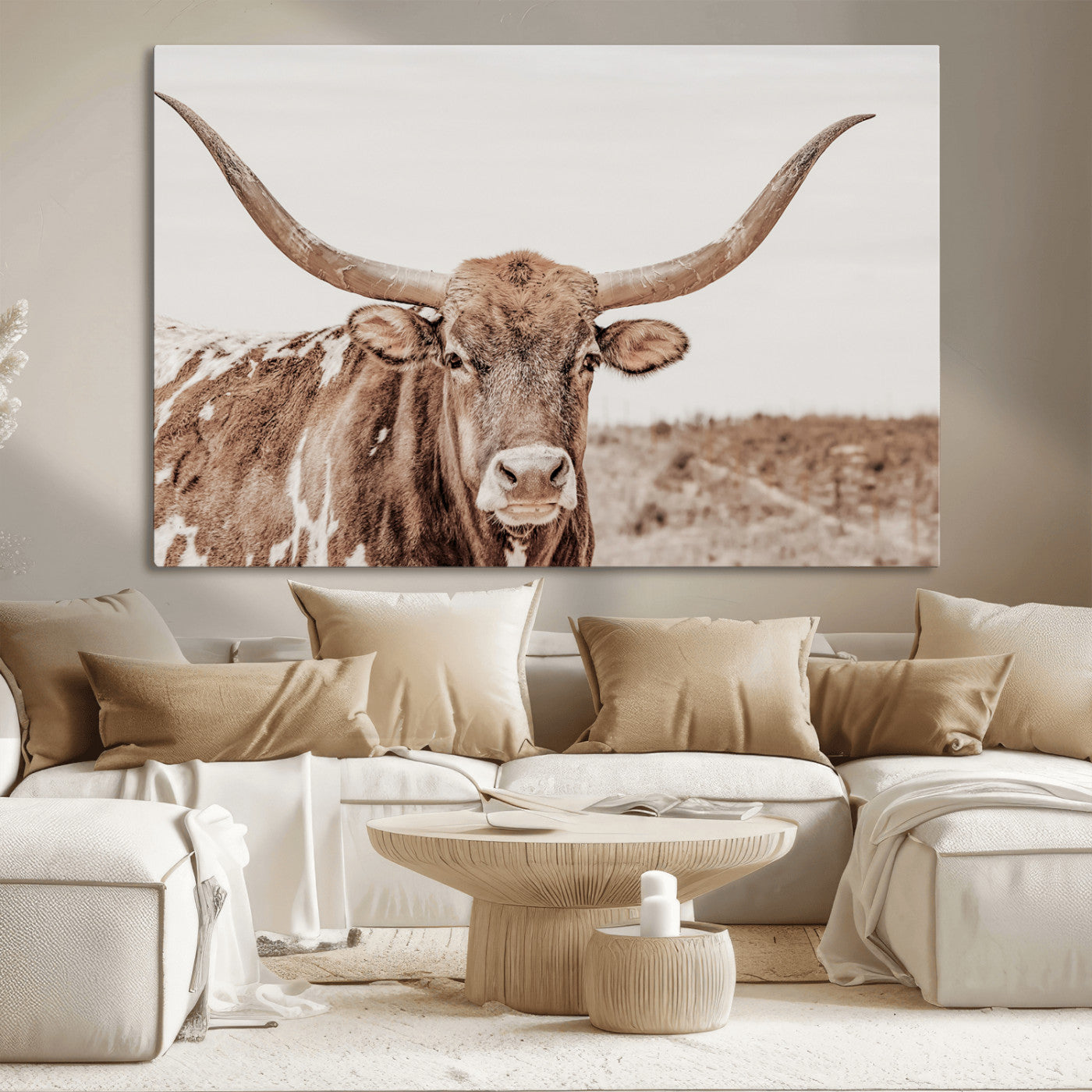 A longhorn cow in soft beige desert tones, standing calmly in open land, perfect for neutral western or rustic farmhouse interiors.