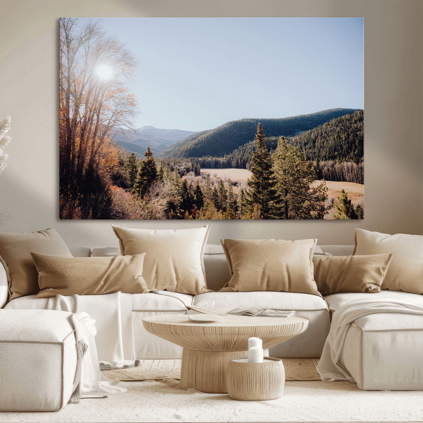 A scenic mountain valley with pine trees and autumn foliage under a clear sky, bathed in golden sunlight, creating a peaceful and rustic landscape.