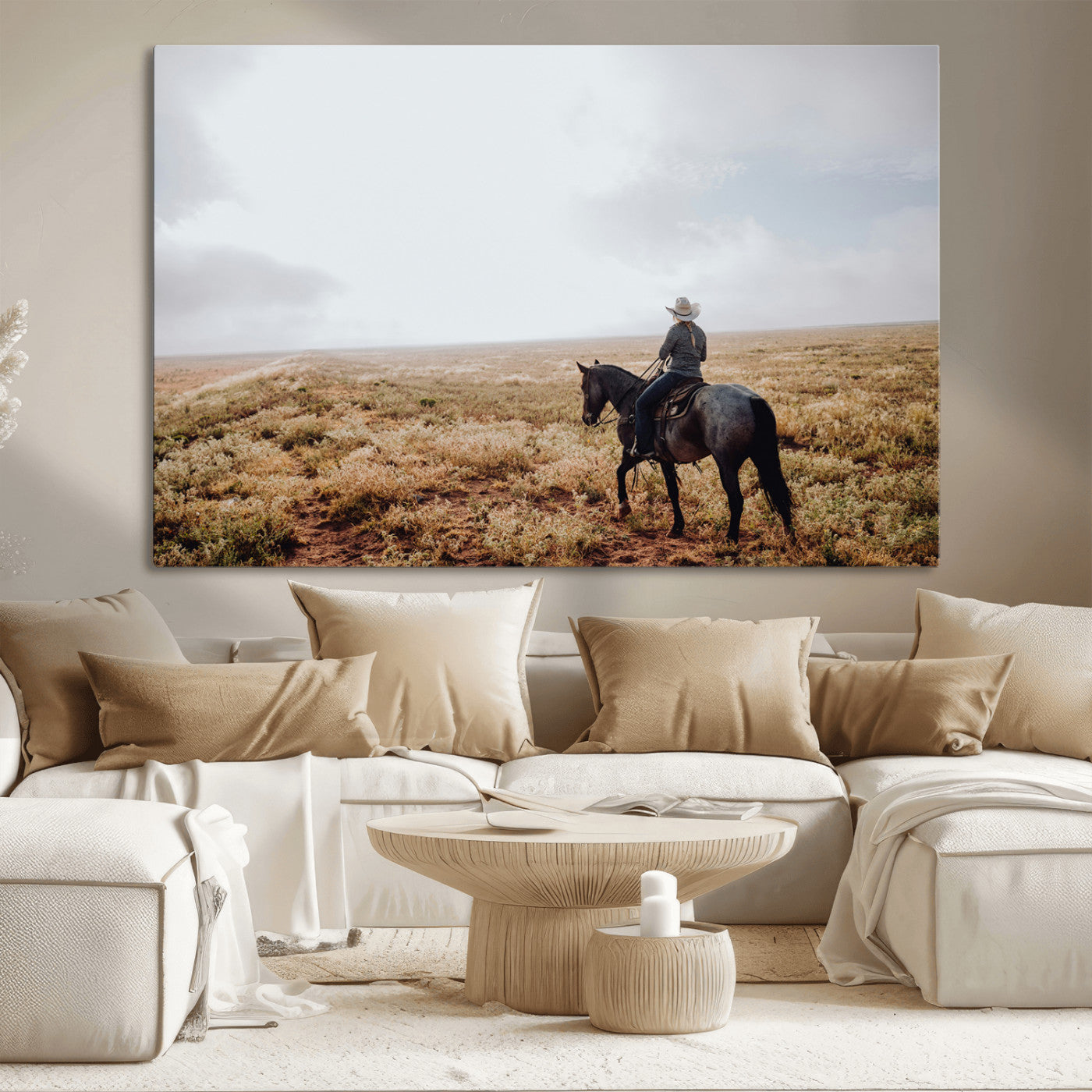 A lone cowboy riding horseback across an open prairie under a vast sky, capturing the rugged and timeless spirit of the Western frontier.