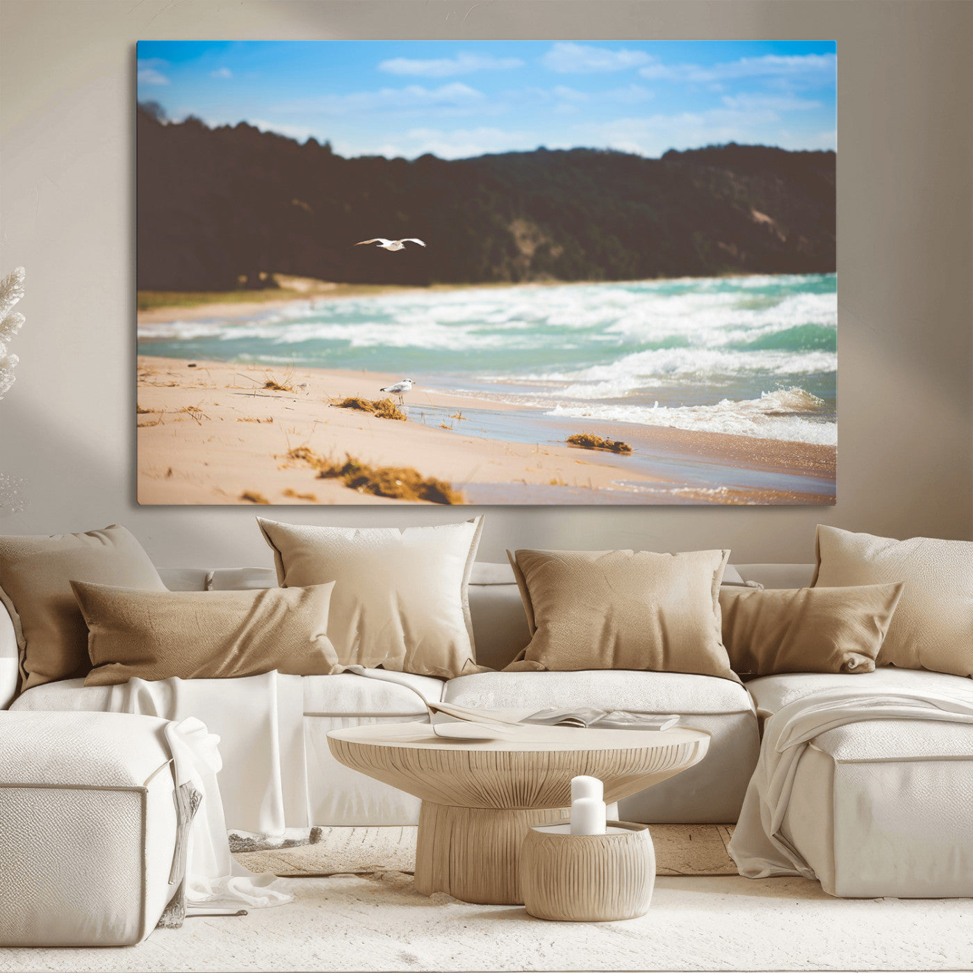 Serene beach scene with gentle ocean waves, sandy shore, and a seagull flying under a blue sky, perfect for coastal and nature-inspired decor.