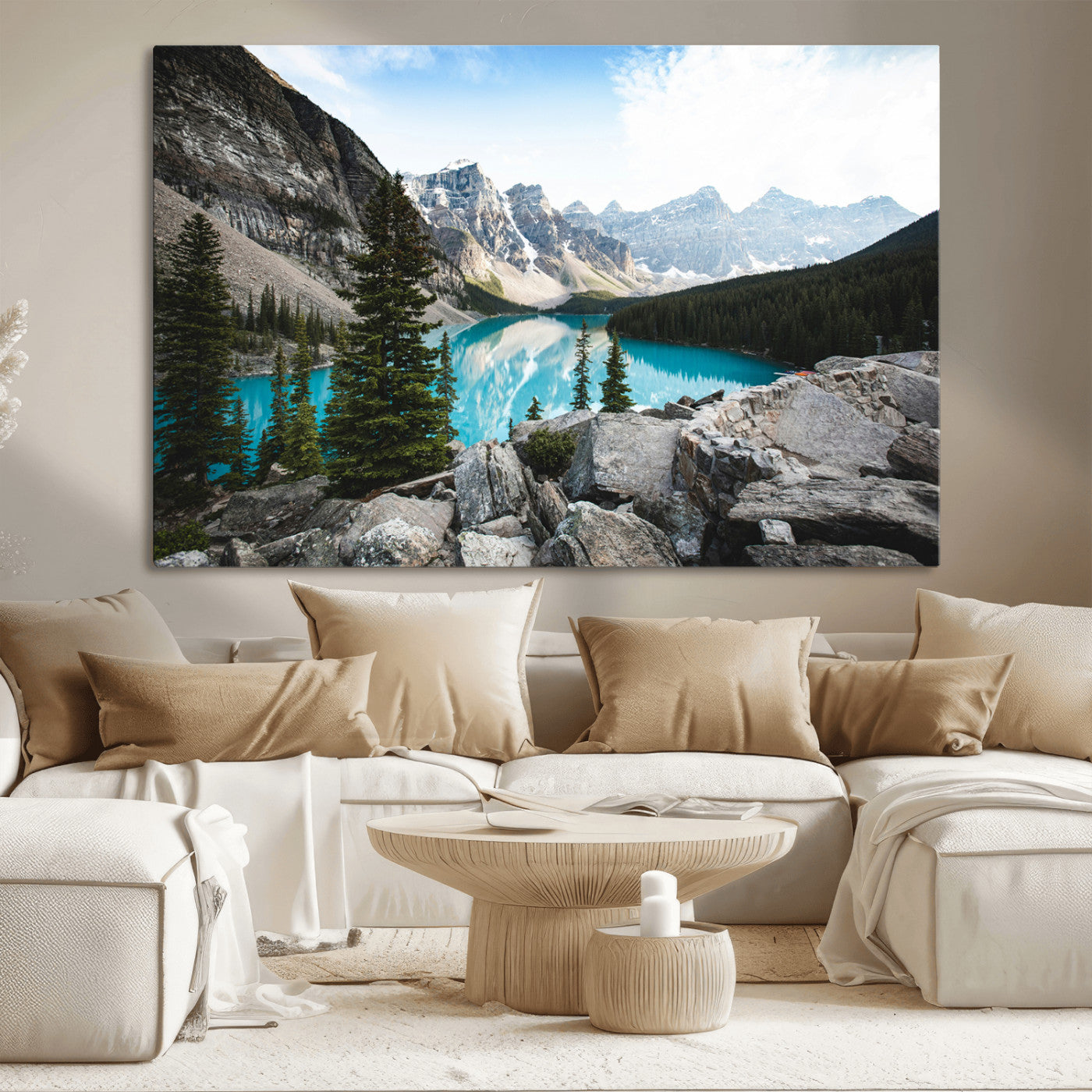 Stunning view of Moraine Lake with turquoise waters reflecting snow-capped mountains and evergreen trees, creating a peaceful alpine decor.