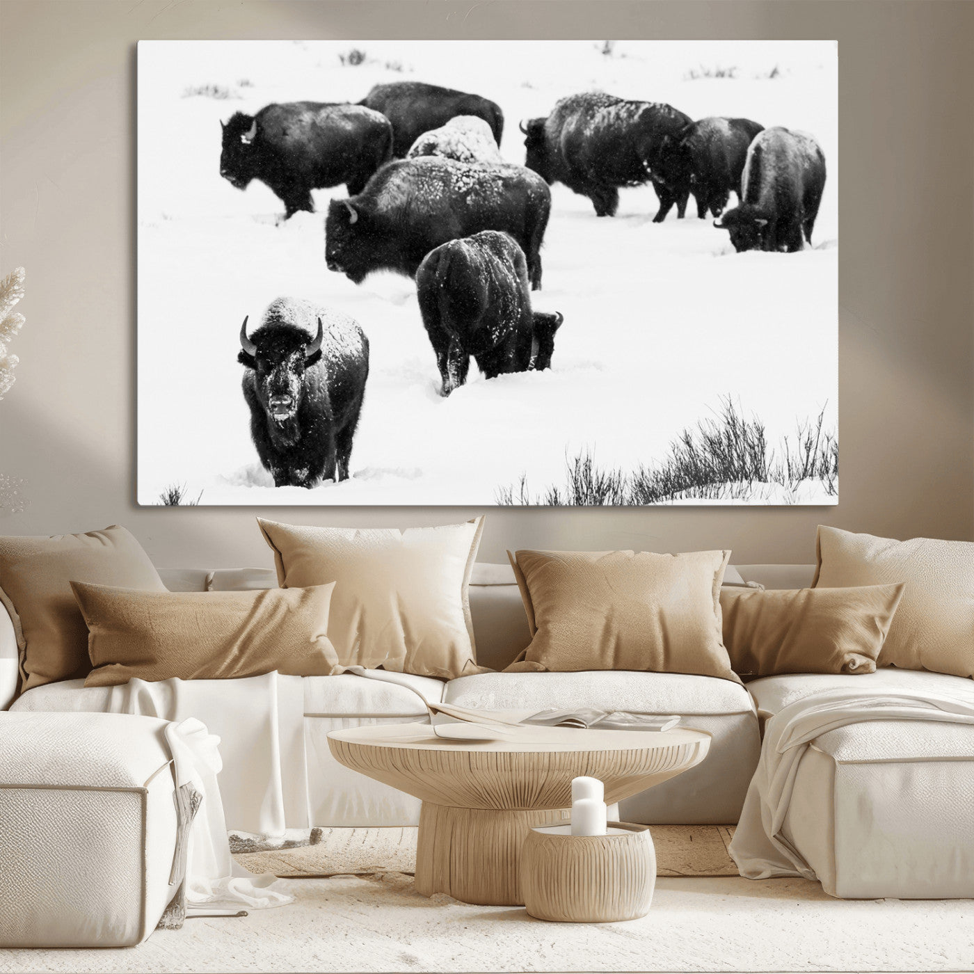 Black and white photograph of a bison herd in a snowy landscape, with snow-covered fur and a rugged wilderness setting, perfect for rustic lodge decor.